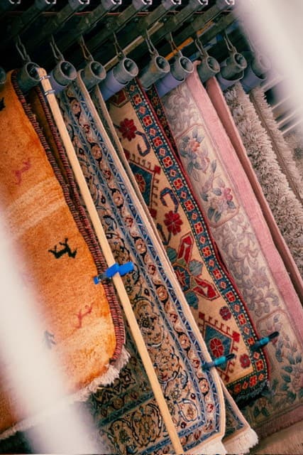 Rugs hanging to dry in the Tapis Clean workshop